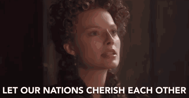 a woman with curly hair says let our nations cherish each other ..