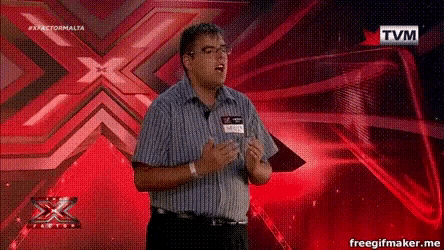 a man stands in front of a red x and a tvm logo