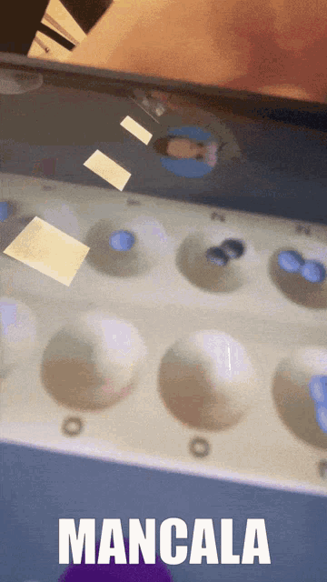 the word mancala that is on a graphic