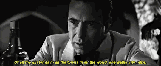 a black and white photo of a man with a bottle of whiskey and the words of all the gin joints