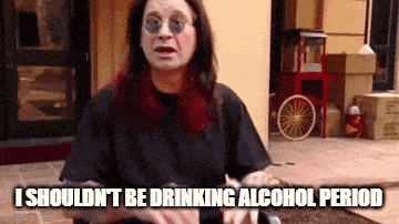 a woman wearing sunglasses and a black shirt says i should n't be drinking alcohol period