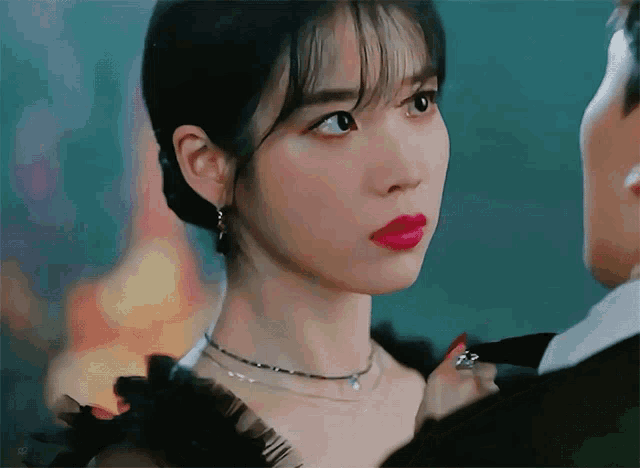 a close up of a woman 's face with red lips