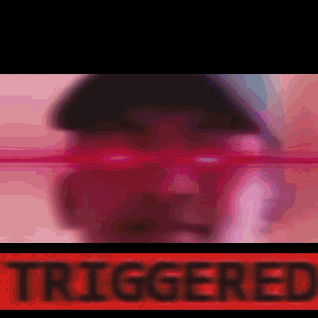 a close up of a person 's face with the word triggered in the corner .
