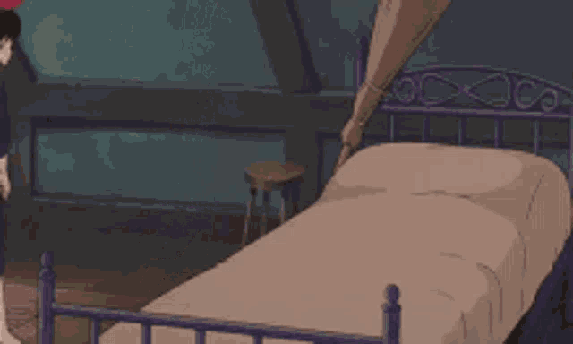 a girl in a purple dress is standing next to a bed in a bedroom .