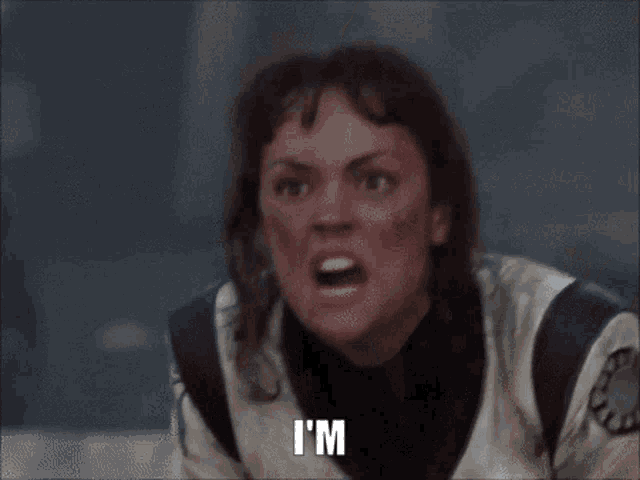 a woman in a white jacket is making a funny face and says to