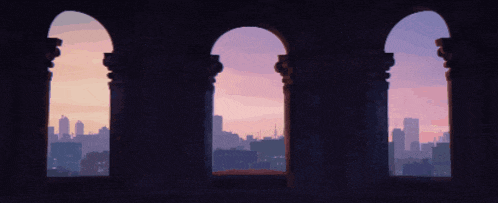 a city skyline is seen through the arches of a building at sunset
