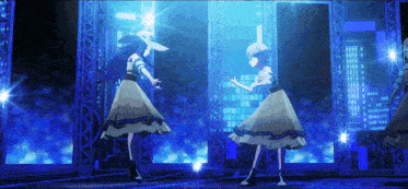 two anime girls are dancing on a stage with a city skyline in the background