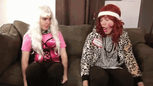 two people are sitting on a couch with one wearing a name tag that says ' jenny john '