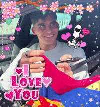 a man is sitting in a car holding a cell phone with the words i love you behind him