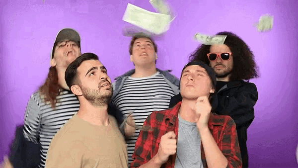 a group of men are looking up at a purple background while money is flying in the air
