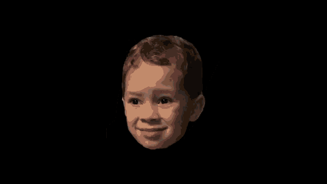 a child 's face is shown with a black background