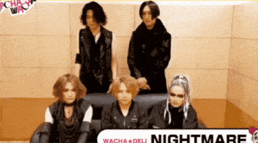 a group of people standing next to each other with a sign that says nightmare