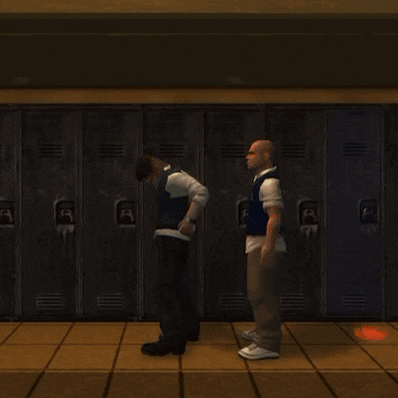 two men standing in front of a row of lockers with letters a and b on them