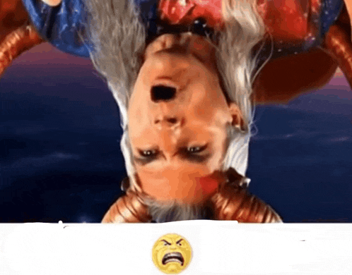 a woman is upside down with an angry face on the bottom