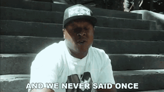 a man wearing a hat says " and we never said once " while sitting on stairs