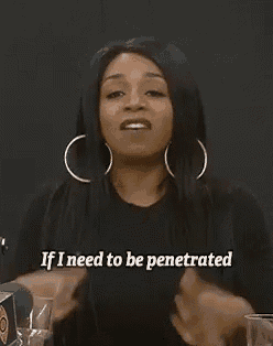 a woman wearing hoop earrings is making a funny face and says if i need to be penetrated .