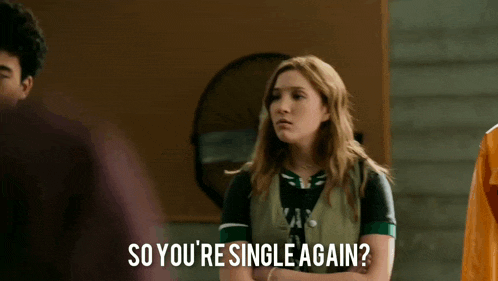 a girl is standing in a room talking to a man and says so you 're single again ?