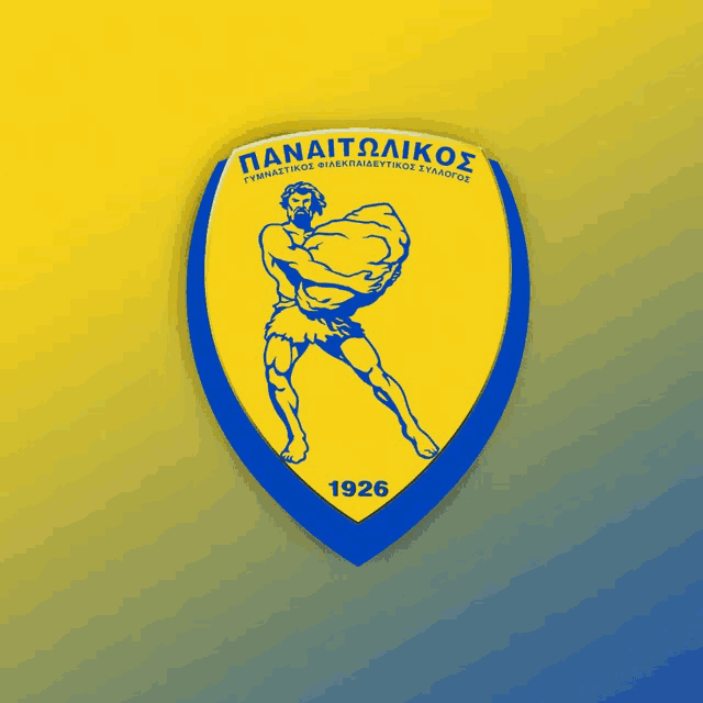 a yellow and blue emblem with a man carrying a rock and the year 1926