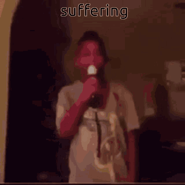 a person singing into a microphone with the word suffering written above them