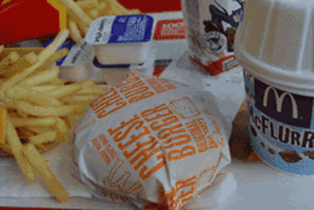 a bunch of mcdonald 's food including a cheese burger