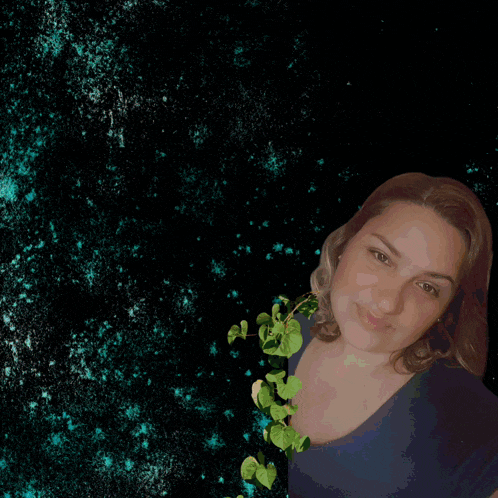 a woman is standing in front of a green letter j