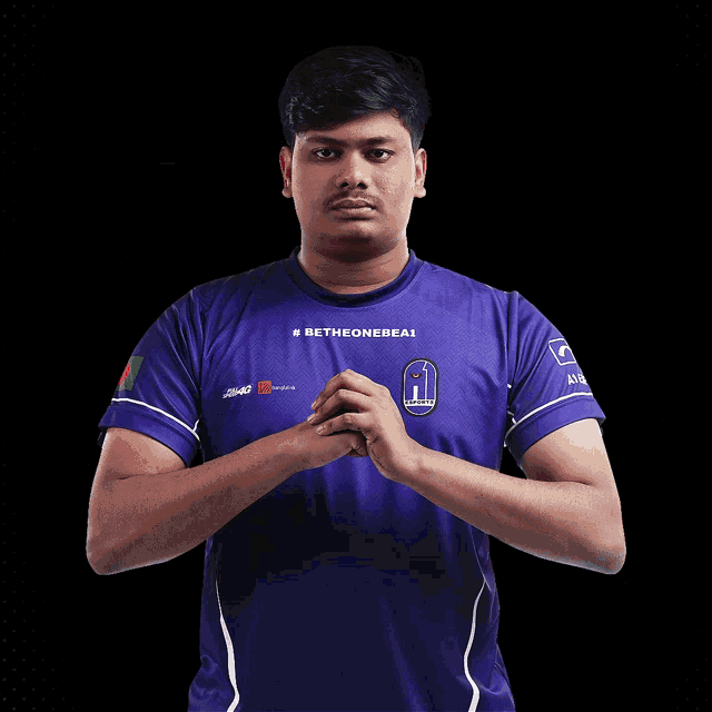 a man wearing a purple jersey with the word chicke on it
