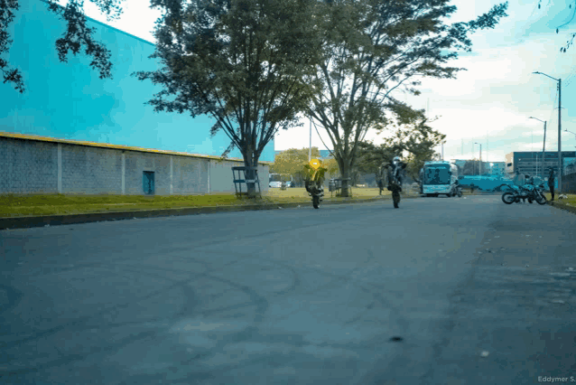 a photo taken by eddymer s. shows people riding motorcycles on a street