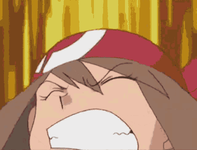 a close up of a cartoon character 's face with a red and white headband on .