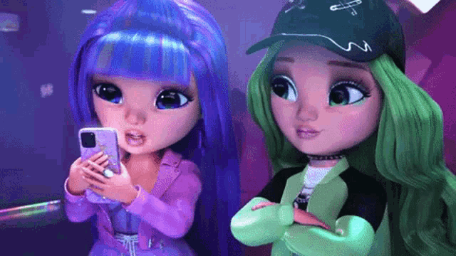 two rainbow high dolls are standing next to each other and looking at a phone .