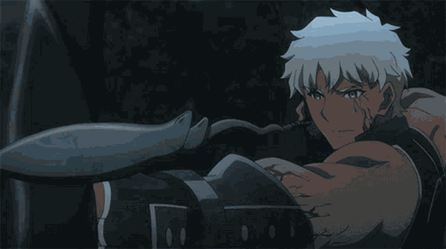 a man with white hair is standing in a dark room with a blue background .
