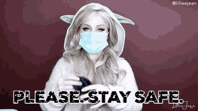 a woman wearing a face mask and a baby yoda costume is asking people to stay safe .