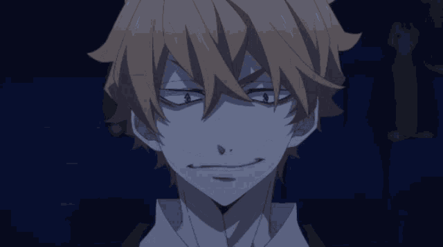 a close up of a man 's face with a smirk on his face