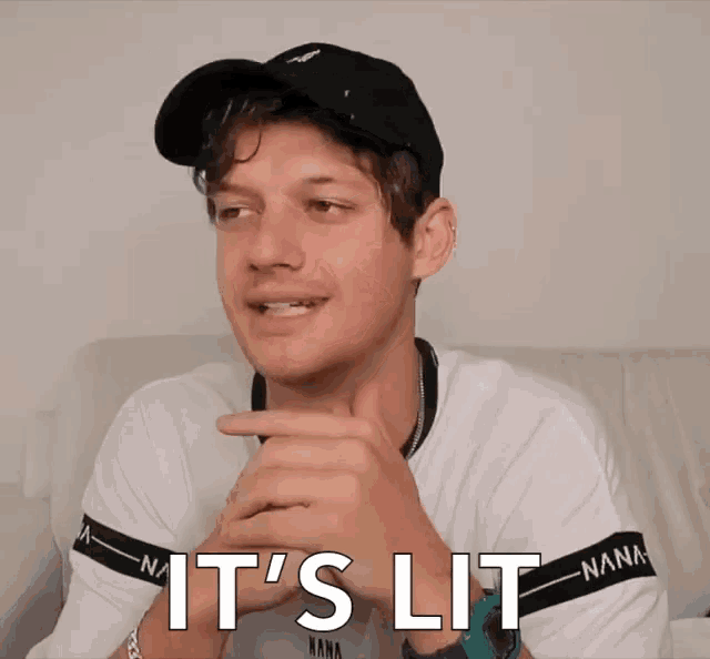 a man wearing a black hat and a white shirt that says nana