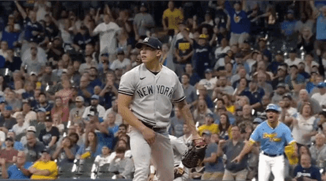a baseball player for the new york yankees throws a ball