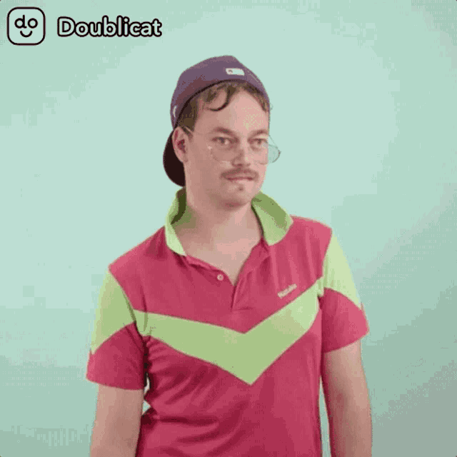a man wearing a purple hat and a pink shirt with doublecat written on the bottom right