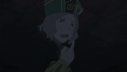 a woman in a green hat points her finger at something in the dark