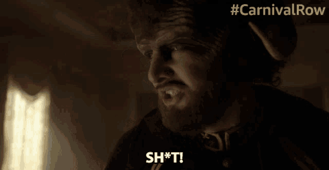 a man with a beard is making a face and says sh*t
