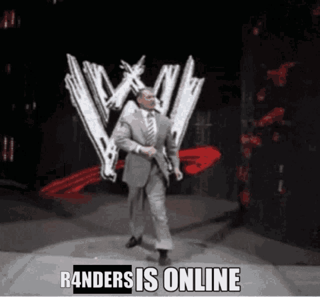 a man in a suit and tie is dancing on a stage with the words randers is online written below him .