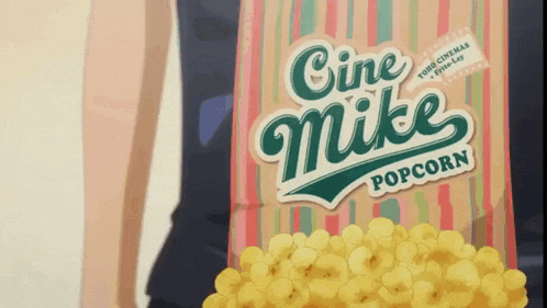 a bag of cine mike popcorn being held by a person