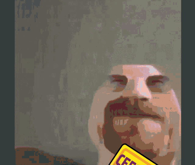a man with a beard is holding a card that says " сегодня " on it