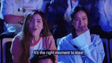 a group of people are watching a movie and one of them is saying " it 's the right moment to kiss "