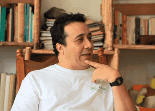 a man wearing a white shirt that says trek