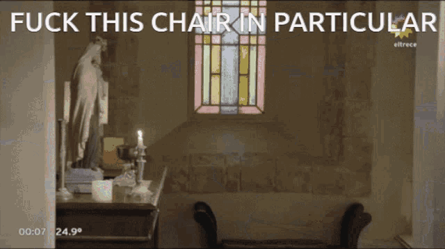 a man standing in front of a stained glass window with the words " fuck this chair in particular " below him