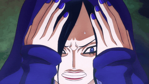 a woman with blue nails is covering her eyes with her hands