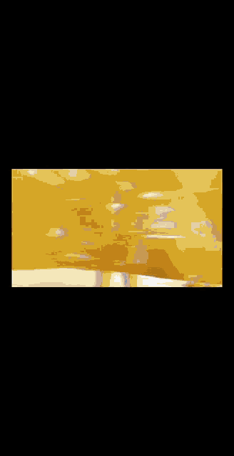 a blurry picture of a person 's face with a yellow background