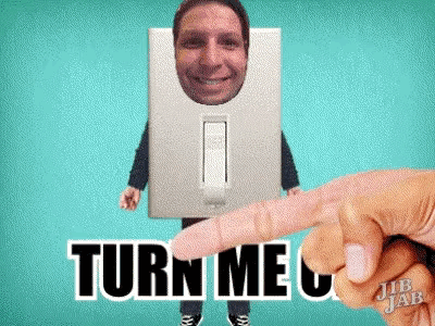 a light switch with a man 's face in it and the words turn me on