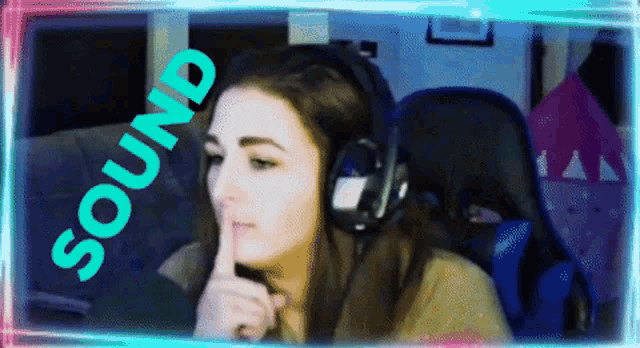 a woman wearing headphones holds her finger to her lips and the word sound is above her