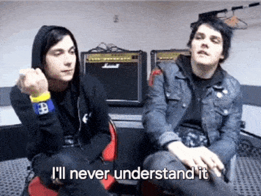 two men are sitting next to each other in a room and one of them is saying i 'll never understand it