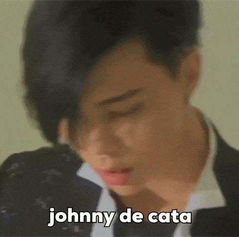 a close up of a man 's face with the words johnny de cata written above him