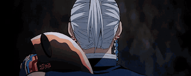 a close up of a person 's back with a sword in his hand